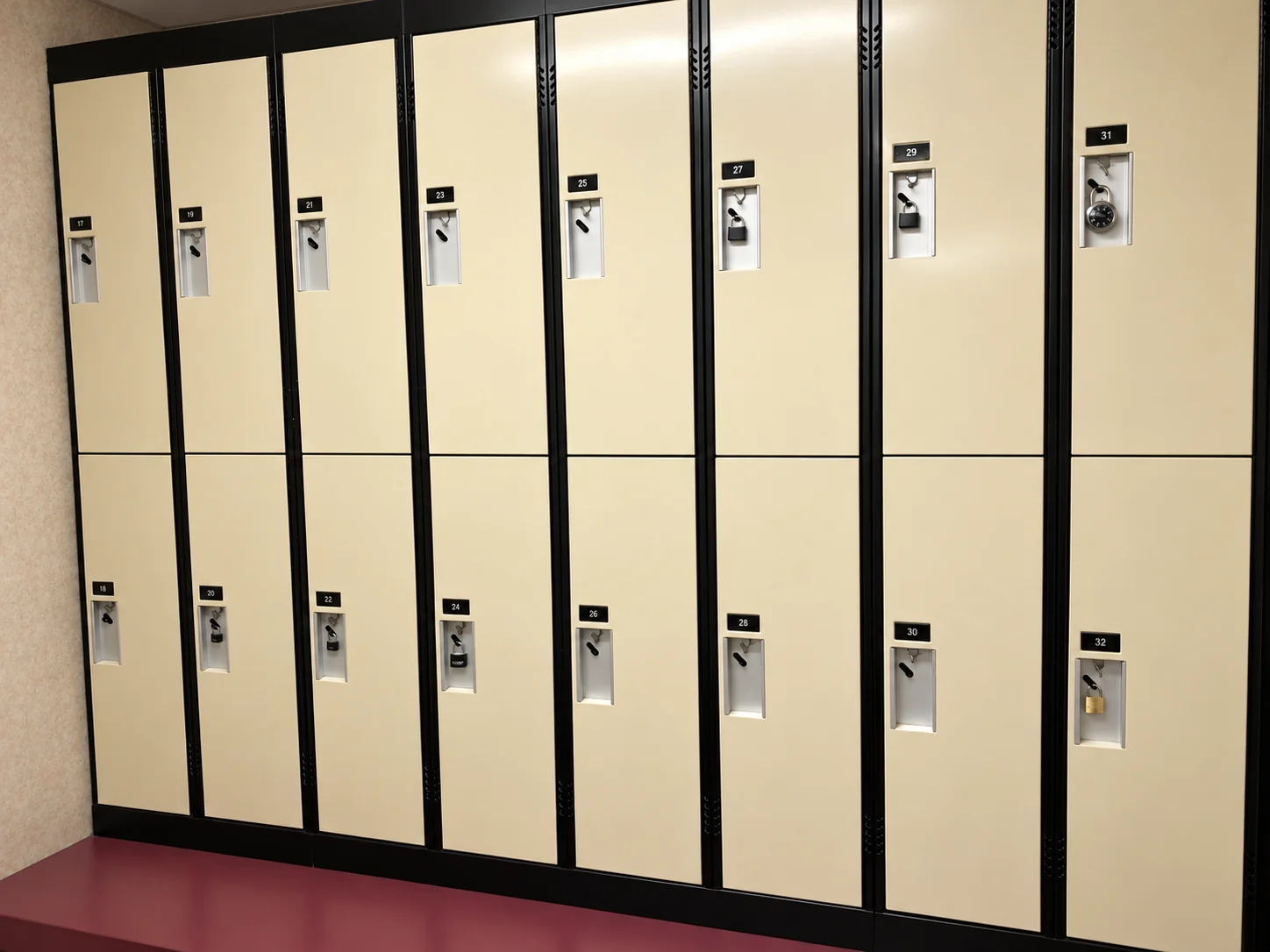 Beige lockers and a bench in the changing area